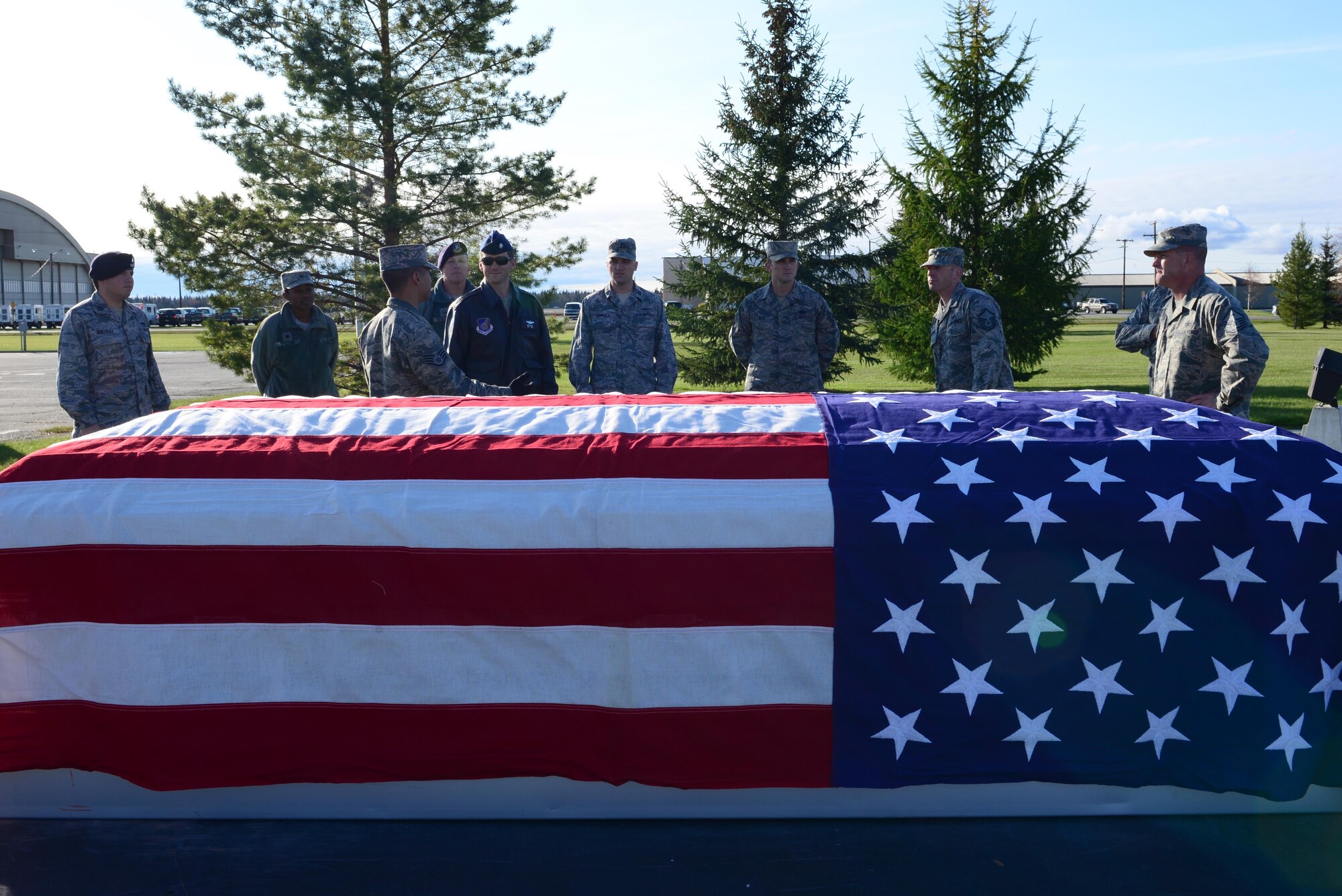 Commanders and squadron leadership are briefed by Tech. Sgt. Aaron Oeth, the 354th Force Support Squadron noncommissioned officer in charge of the Eielson Honor Guard, Sept. 26, 2016, at Eielson Air Force Base, Alaska. The Honor Guard invited leadership out for a job shadowing event where they would learn some of the steps in a funeral detail. (U.S. Air Force photo by Airman 1st Class Cassandra Whitman)