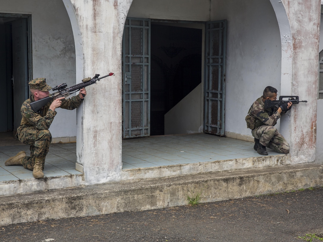TARAVAO, Tahiti – U.S. Marine Lance Cpl. Cory Walters, a combat engineer with Combat Engineer Platoon, Task Forces Koa Moana 16-4, provides security with French forces during urban operations training in Taravao, Tahiti, Sept. 23, 2016. American and French forces worked together to build partnership and learn from each other’s tactics. (U.S. Marine Corps photo by Lance Cpl. Quavaungh Pointer)