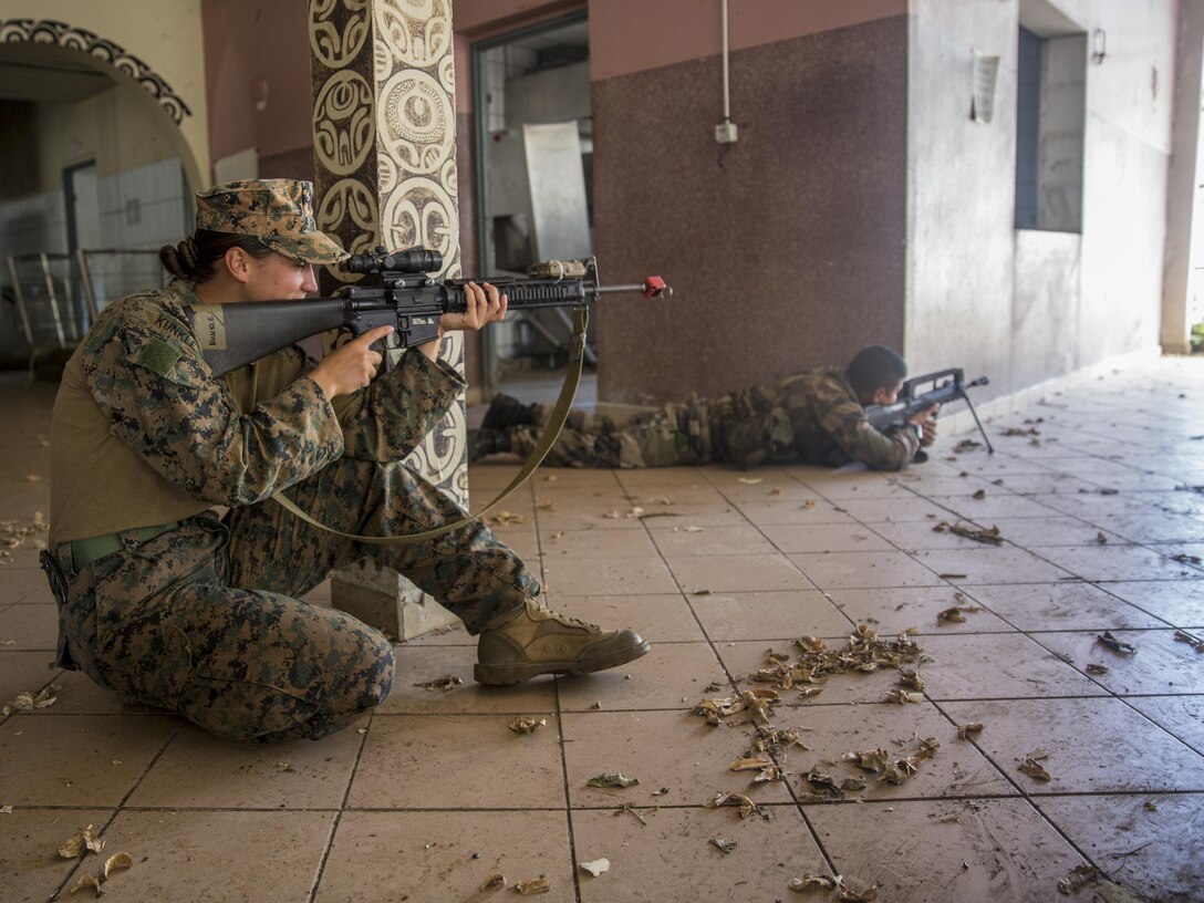 TARAVAO, Tahiti – U.S. Marine Cpl. Tayler Kunkle, a military police Marine with Law Enforcement Detachment, Task Forces Koa Moana 16-4, provides security with French forces during urban operations training in Taravao, Tahiti, Sept. 23, 2016. American and French forces worked together to build partnership and learn from each other’s tactics. (U.S. Marine Corps photo by Lance Cpl. Quavaungh Pointer)