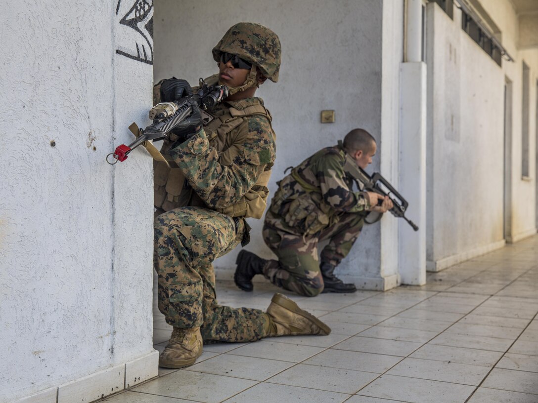 Tahiti – U.S. Marine Cpl. Woodrow Jackson, a military police Marine with Law Enforcement Detachment, Task Forces Koa Moana 16-4, provides security with French forces during urban operations training in Taravao, Tahiti, Sept. 23, 2016. American and French forces worked together to build partnership and learn from each other’s tactics. (U.S. Marine Corps photo by Lance Cpl. Quavaungh Pointer)