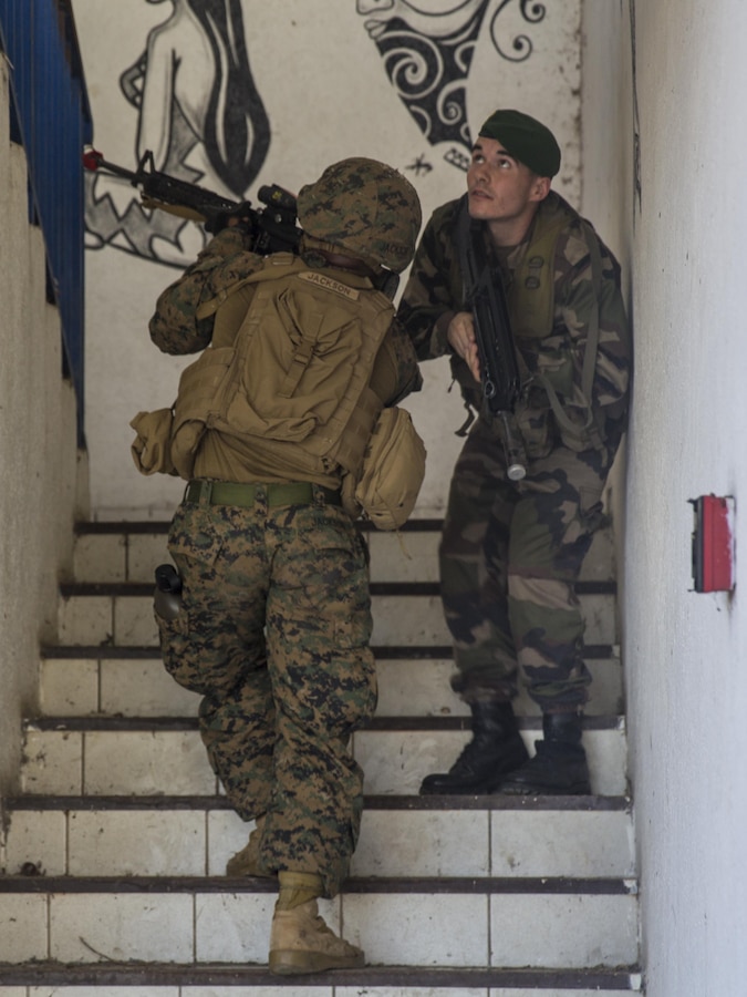 Tahiti – U.S. Marine Cpl. Woodrow Jackson, a military police Marine with Law Enforcement Detachment, Task Forces Koa Moana 16-4, clears a stairway with French forces during urban operations training in Taravao, Tahiti, Sept. 23, 2016. American and French forces worked together to build partnership and learn from each other’s tactics. (U.S. Marine Corps photo by Lance Cpl. Quavaungh Pointer)