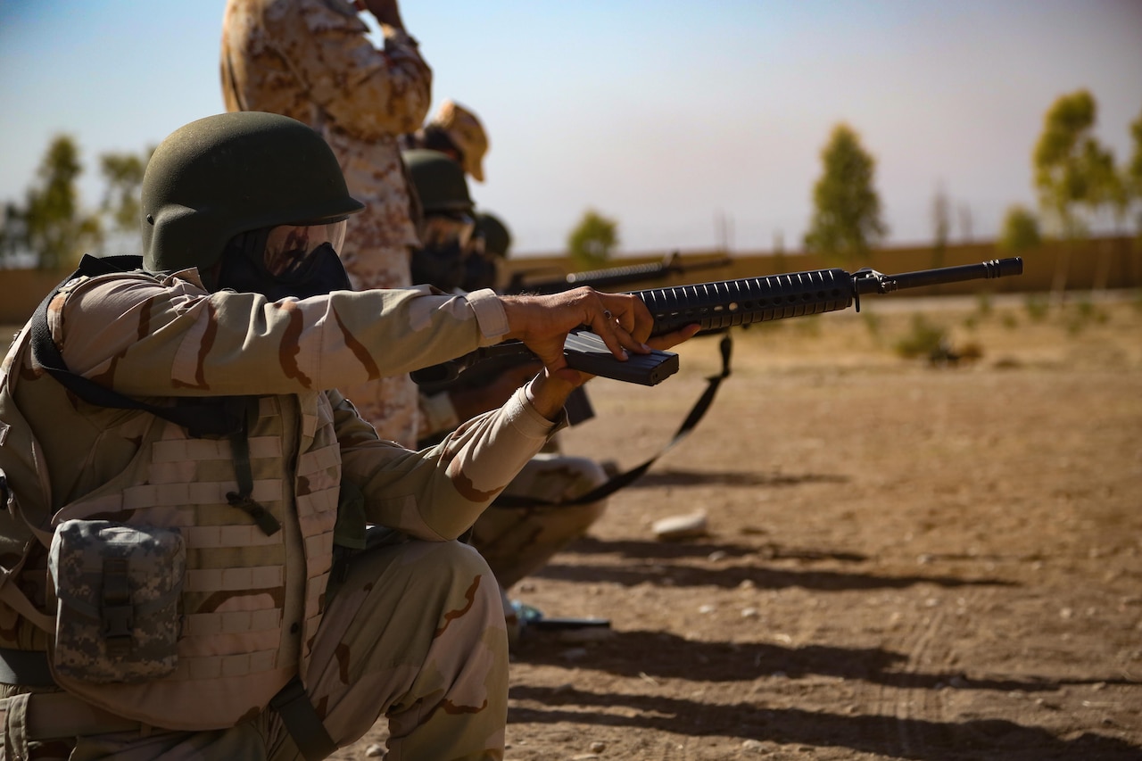 A Peshmerga soldier loads his M16 rifle during a chemical, biological, radiological and nuclear defense class taught by Italian trainers at Bnaslawa, Iraq, Sept. 21, 2016. CBRN training is provided to Peshmerga soldiers in case chemical weapons are used by the Islamic State of Iraq and the Levant. This training is part of the overall Combined Joint Task Force – Operation Inherent Resolve building partner capacity mission to increase the security capacity of local forces fighting ISIL. 