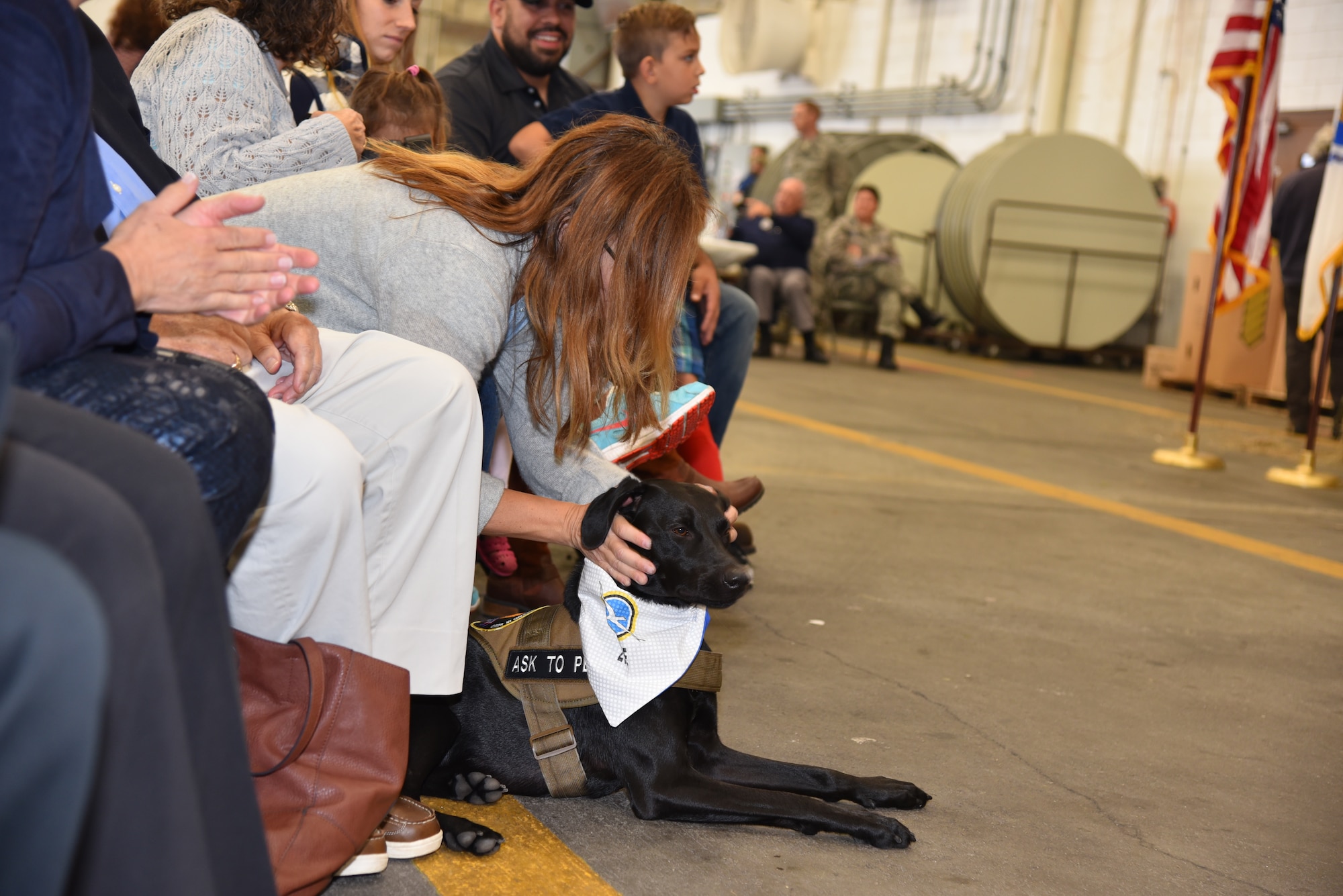 The 102nd Intelligence Wing celebrates their annual Family Day event at Otis Air National Guard base on Oct. 2, 2016. During the annual event there were various awards presented, along with multiple Community College of the Air Force degrees, and Zoe the therapy dog was enlisted as the newest member of the unit.(National Guard Photo by Tech. Sgt. Lindsey Sarah Watson-Kirwin/Released)