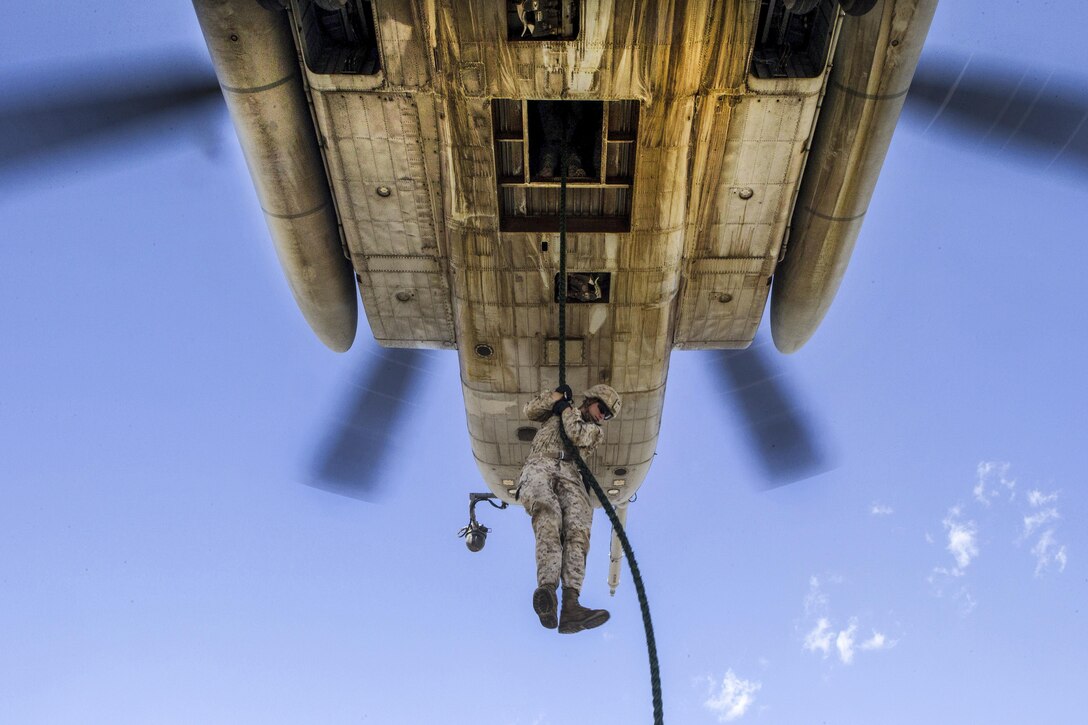 A Marine participates in fast-rope training from a CH-53E Super Stallion helicopter at an airfield in Yuma, Ariz., Sept. 30, 2016. Marine Corps photo by Cpl. Aaron James Vinculado