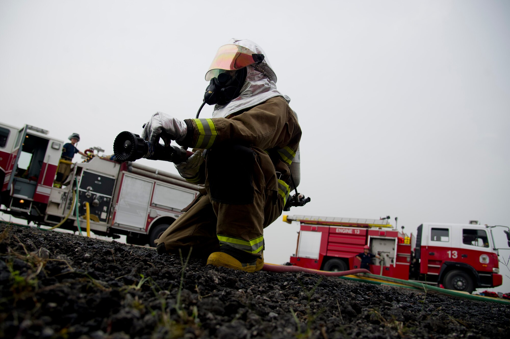 A U.S. Air Force firefighter from the 51st Civil Engineer Squadron waits to enter a structural fire scenario at Camp Humphries, Republic of Korea, Sept. 28, 2016. The 51st CES firefighters practiced tactics and techniques for structural fires. (U.S. Air Force photo by Staff Sgt. Jonathan Steffen)