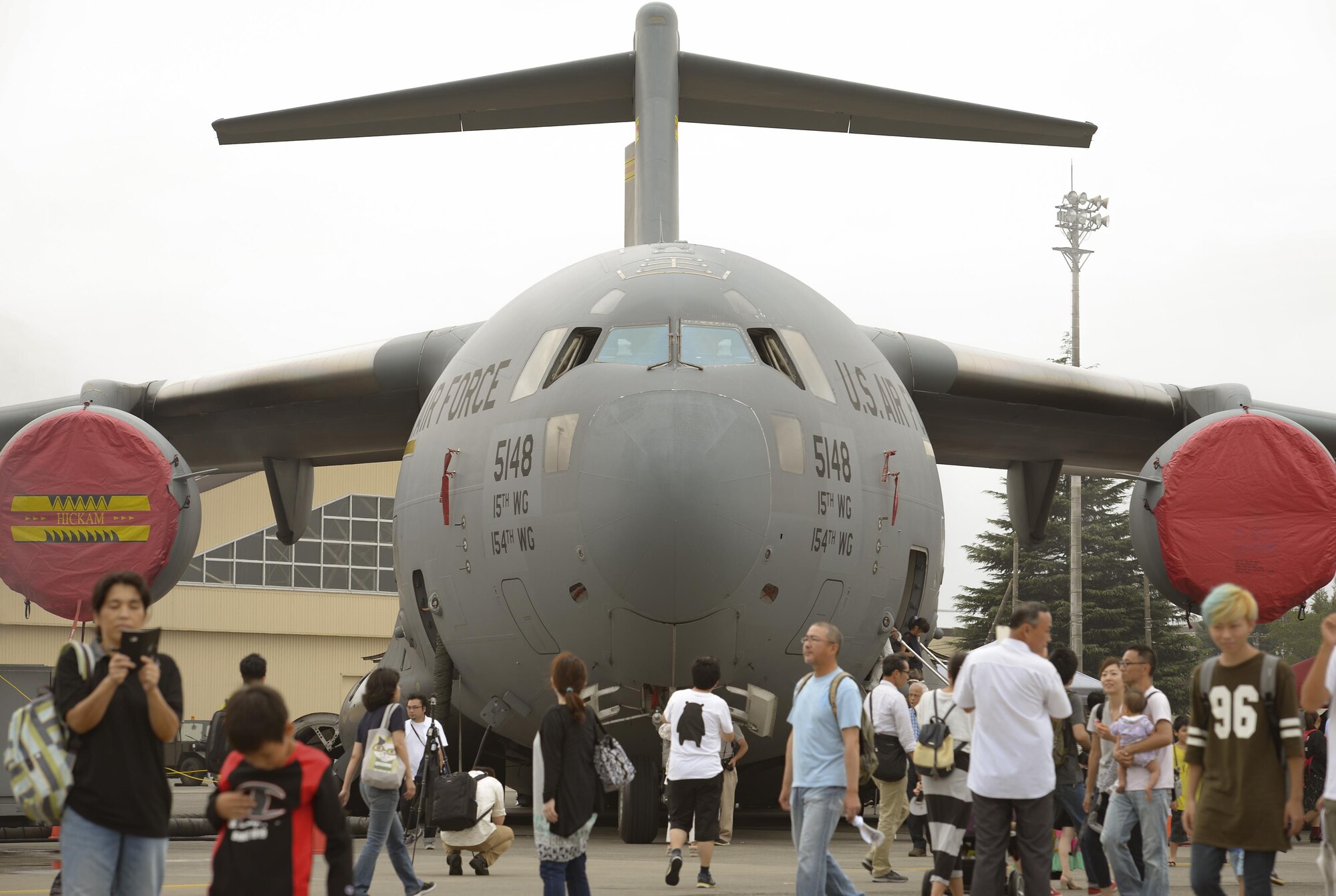 Festivalgoers explore the flight line in front of a C-5 Galaxy static aircraft display during the 2016 Japanese-American Friendship Festival at Yokota Air Base, Japan, Sept. 17, 2016. The festival gives community members a chance to come onto Yokota to see static aircraft, witness military demonstrations, learn about the capabilities and training done at Yokota and to meet with the US and Japan Self-Defense Force members who work and live here. (U.S. Air Force photo by Airman 1st Class Elizabeth Baker/Released)