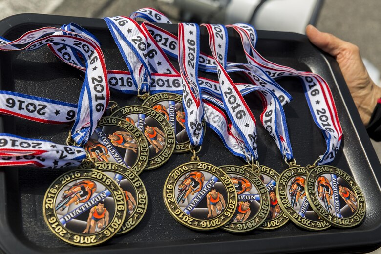 Athletes received medals after completing a duathlon during the Special Olympics Nippon Hiroshima at Marine Corps Air Station Iwakuni, Japan, Oct. 2, 2016. The Special Olympics instills confidence, inspires a sense of competition and improves health through the transformative power of sports. Hosting the event here helps service members and their families build stronger relationships with Japanese civilians by breaking language barriers and promoting positive interaction in a foreign country. (U.S. Marine Corps photo by Lance Cpl. Aaron Henson)