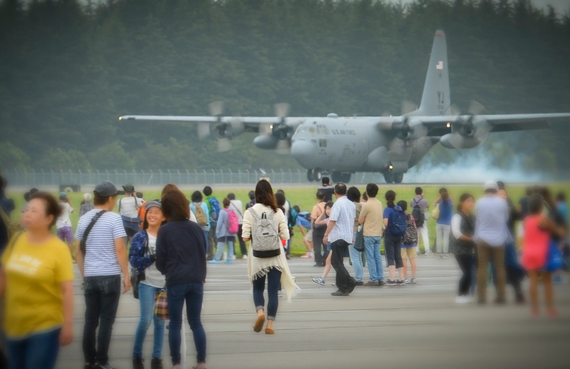 A C-130H Hercules assigned to the 36th Airlift Squadron touches down during the 2016 Japanese-American Friendship Festival Yokota Air Base, Japan, Sept. 17, 2016. The festival hosted food vendors, static aircraft displays, live entertainment and military and government demonstrations.  (U.S. Air Force photo by Airman 1st Class Elizabeth Baker/Released)