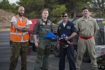 Members of The Royal Netherlands air force from Leeuwarden Airbase, The Netherlands, pose for a photo with U.S. Air Force dedicated crew chiefs from the 48th Aircraft Maintenance Squadron during Tactical Leadership Programme 16-3 at Los Llanos Air Base, Spain, Sept. 26. The training prepares NATO and allied forces flight leaders to serve as mission commanders, lead coalition force air strike packages, and provide tactical air expertise to NATO agencies. (U.S. Air Force photo/ Staff Sgt. Emerson Nuñez)