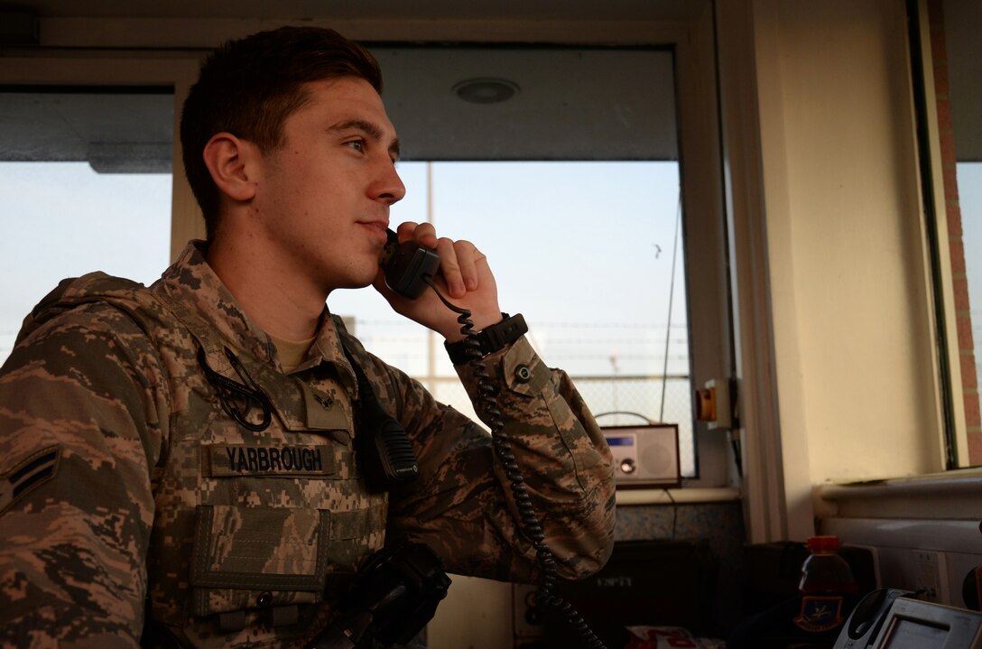 U.S. Air Force Airman 1st Class Jacob Yarbrough, 100th Security Forces Squadron response force member, receives a telephone call from a patrolman Sept. 23, 2016, on RAF Mildenhall, England. Yarbrough works the nightshift defending the base and keeping its population safe. (U.S. Air Force photo by Gina Randall)