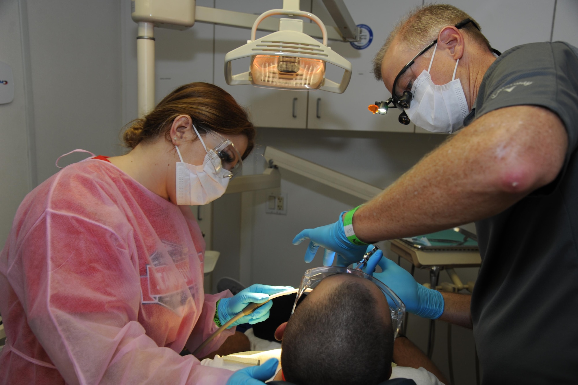 Staff Sgt. Kerry Tromba, 927th Force Support Squadron, MacDill Air Force Base also a dental assistant along with Dr. Stephen Durrett provide dental care during Operation Stand Down, an event designed to help local homeless veterans combating life on the streets. The event, held at the Veteran Memorial Park, Hudson, Florida, bussed in homeless veterans from surrounding areas to take advantage of the more than a dozen complimentary services, such as employment workshops, hot meals, hot showers and haircuts, and medical services. (U.S. Air Force photo by Tech. Sgt. Peter Dean)