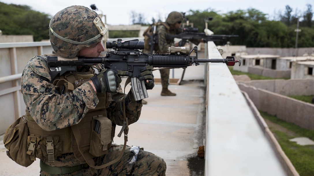 Lance Cpl. Sean Clancy, a squad leader with Charlie Company, 1st Battalion, 3rd Marine Regiment, and a Hampshire, Illinois native, provides security from a rooftop during Exercise Island Viper aboard Marine Corps Training Area Bellows, Sept. 29, 2016. Exercise Island Viper is a 3-week-long battalion level training evolution workup that focuses on sharpening the infantry skills of the individual, team and squad.
