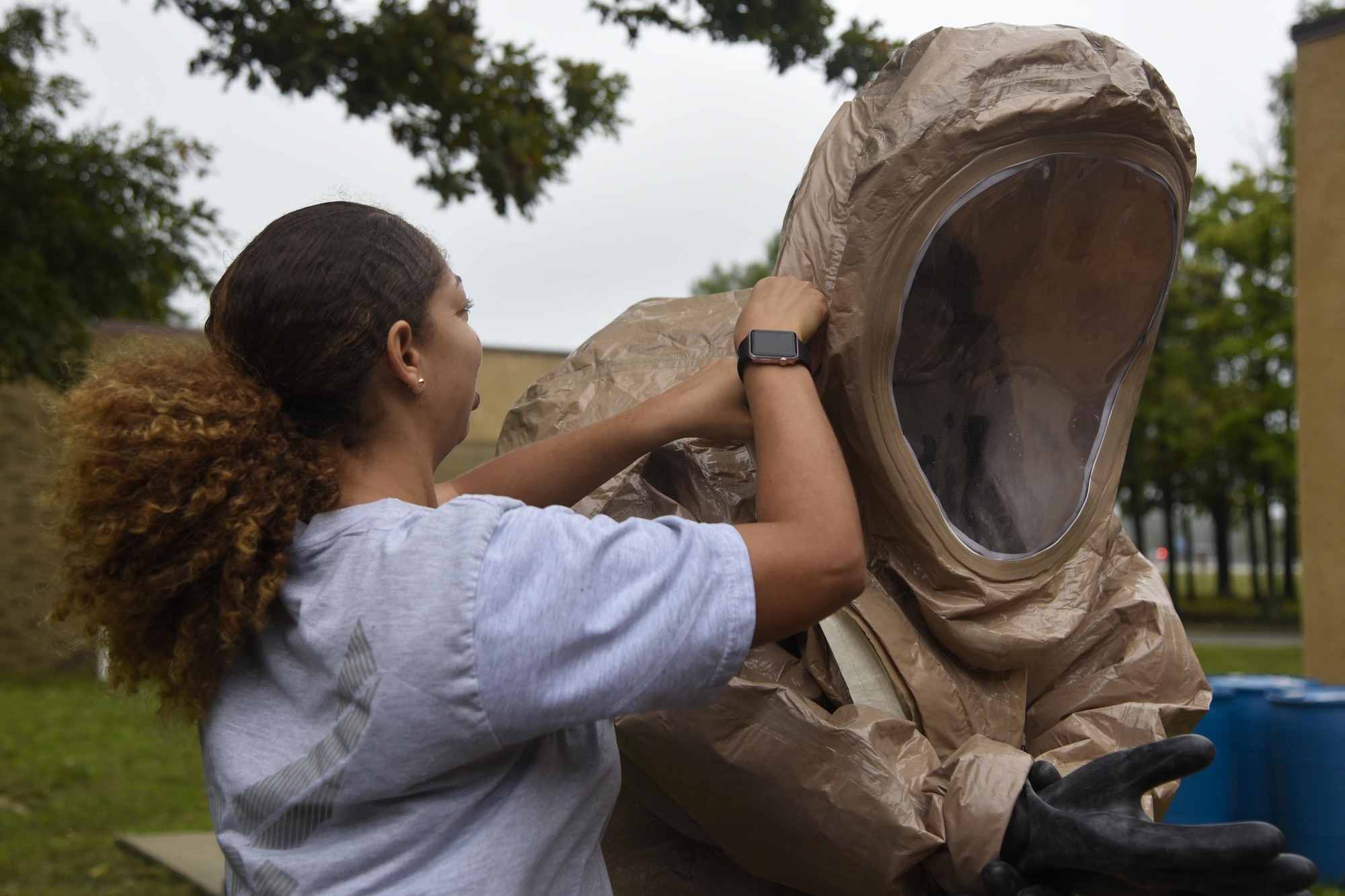 Tech. Sgt. Danielle M. Clark, left, 11th Civil Engineer Squadron section chief of emergency management, zips up a hazardous material suit on Airman 1st Class Cody Young, 11th CES readiness and emergency manager, during HAZMAT training on Joint Base Andrews, Md., Sept. 29, 2016. Emergency management flight practices HAZMAT exercises in order to be ready to take action if a toxic spill mishap occurs. 11th CES practices HAZMAT exercises because they must be ready to take action if a HAZMAT mishap occurs. The suit’s zip lock seal design protects readiness and emergency managers from the hazardous material. (U.S. Air Force photo by Airman 1st Class Valentina Lopez)