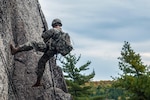 Spc. Glen Mallett, with the Maine Army National Guard’s B Company, 3rd Battalion, 172nd Infantry Regiment (Mountain), kicks off the rock face while repelling at Eagles Bluff, a cliff area in Maine with rock faces up to 200 feet in height. Mallett and his fellow Soldiers spent time at Eagles Bluff training on mountaineering, rappelling, knot tying and medical evacuation skills. 