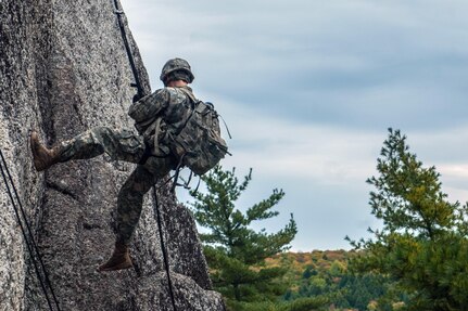 Spc. Glen Mallett, with the Maine Army National Guard’s B Company, 3rd Battalion, 172nd Infantry Regiment (Mountain), kicks off the rock face while repelling at Eagles Bluff, a cliff area in Maine with rock faces up to 200 feet in height. Mallett and his fellow Soldiers spent time at Eagles Bluff training on mountaineering, rappelling, knot tying and medical evacuation skills. 