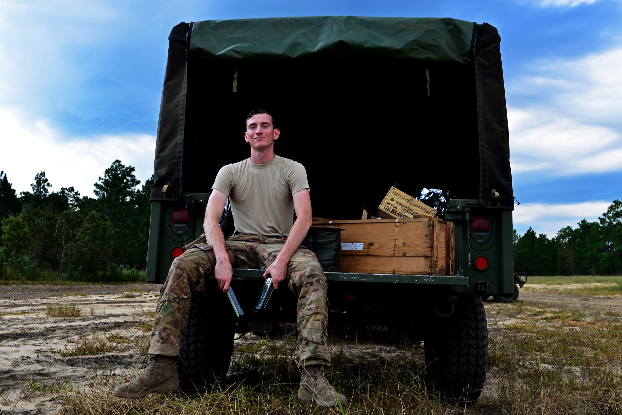U.S. Air Force Senior Airman Tyler McMillan Wammack, 20th Civil Engineer Squadron explosive ordnance disposal journeyman, sits in the back of a Humvee at Poinsett Electronic Combat Range, Wedgefield, S.C., Sept. 29, 2016. EOD Airmen are responsible for improvised explosive device support, aerospace recovery, and defense support for civil authorities.  (U.S. Air Force photo by Airman 1st Class Destinee Sweeney)