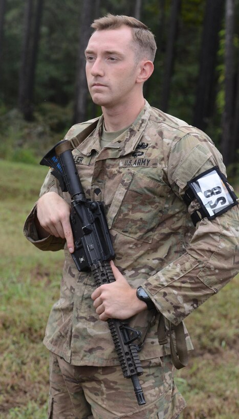 Spc. Robert Miller prepares for an event during the Best Warrior Competition at Fort A.P. Hill, Virginia, Sept. 28, 2016.