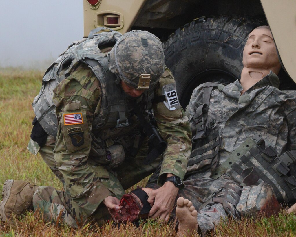 Sgt. 1st Class Joshua Moeller provides medical aid to a field dummy during the Best Warrior Competition at Fort A.P. Hill, Va., Sept. 28, 2016.