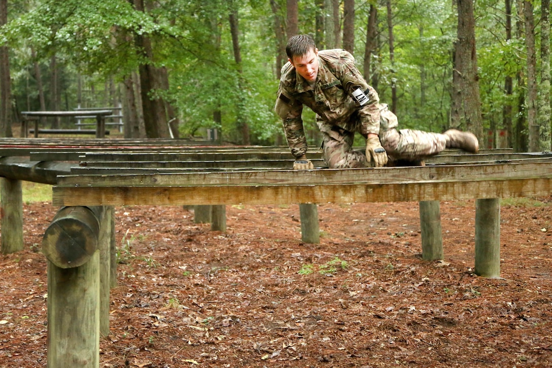 Army Staff Sgt. Clinton Bahme jumps over a hurdle obstacle during the Army's 2016 Best Warrior Competition at Fort A.P. Hill, Va., Sept. 27, 2016. Bahme is assigned to the U.S. Army Special Operations Command. The competition is an annual weeklong event testing 20 soldiers from 10 major commands on their physical and mental capabilities. Army photo by Pfc. Jada Owens