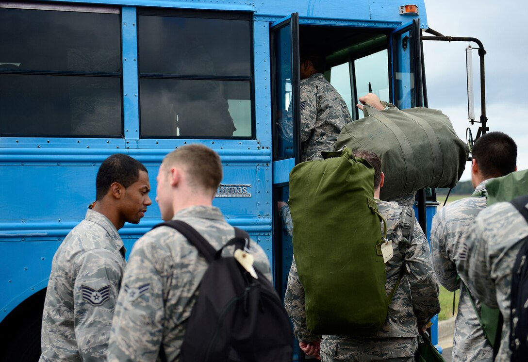 U.S. Air Force Airmen simulate boarding an aircraft during an operational readiness exercise at Joint Base Langley-Eustis, Va., Sept. 28, 2016. Over the past five days, wing exercise evaluation team members assessed the base’s readiness to deploy with short-notice. (U.S. Air Force photo by Airman 1st Class Kaylee Dubois)