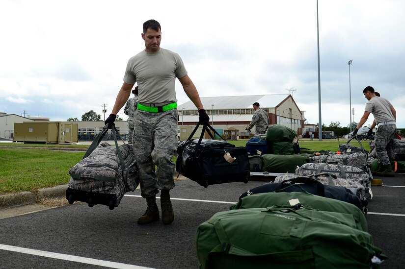 U.S. Air Force Tech. Sgt. Sean Simpson, 1st Maintenance Squadron fuel systems repair technician, unloads cargo during an operational readiness exercise at Joint Base Langley-Eustis, Va., Sept. 28, 2016. Along with the simulation of deploying Airmen, the exercise assessed the base’s ability to deploy cargo and aircraft within a limited time frame. (U.S. Air Force photo by Airman 1st Class Kaylee Dubois)