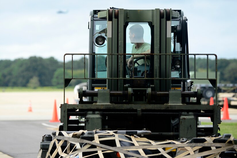 A U.S. Air Force Airman, assigned to the 1st Maintenance Squadron, hauls equipment during an operational readiness exercise at Joint Base Langley-Eustis, Va., Sept. 28, 2016. During the exercise, Airmen were tested on their skills, knowledge and ability to meet the requirements necessary to deploy at a moment’s notice. The exercise was an evaluation of the base’s ability to prepare and deploy personnel, equipment and support assets to a combat environment. (U.S. Air Force photo by Airman 1st Class Kaylee Dubois)