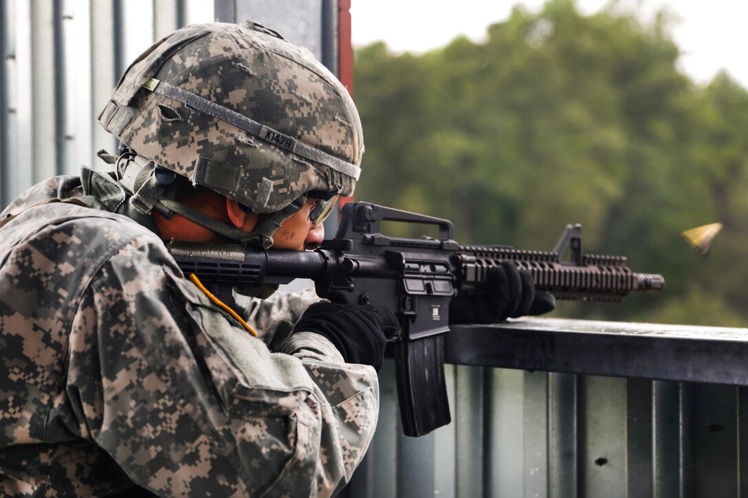 Army Sgt. Mitchell Keeton fires his weapon at targets from an elevated postion during the Army's 2016 Best Warrior Competition at Fort A.P. Hill, Va., Sept. 27, 2016. Keeton is assigned to Army Materiel Command. Army photo by Pfc. Fransico Isreal