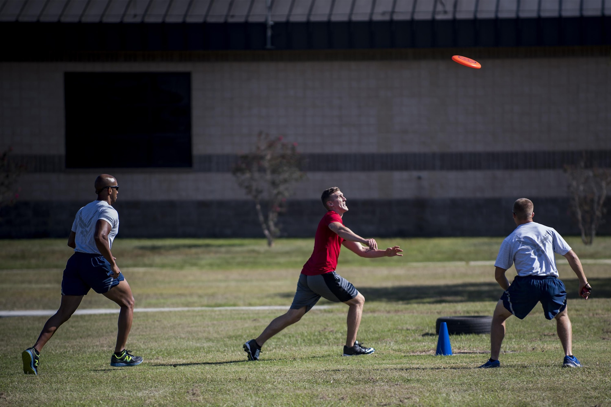 U.S. Air Force Airmen from the 23d Wing race after a flying disk during Comprehensive Airman Fitness day, Sept. 30, 2016, at Moody Air Force Base, Ga. This CAF day focused on the physical and social pillars, offering Airmen a chance to compete in sports and connect with fellow Airmen. (U.S. Air Force photo by Airman 1st Class Daniel Snider)