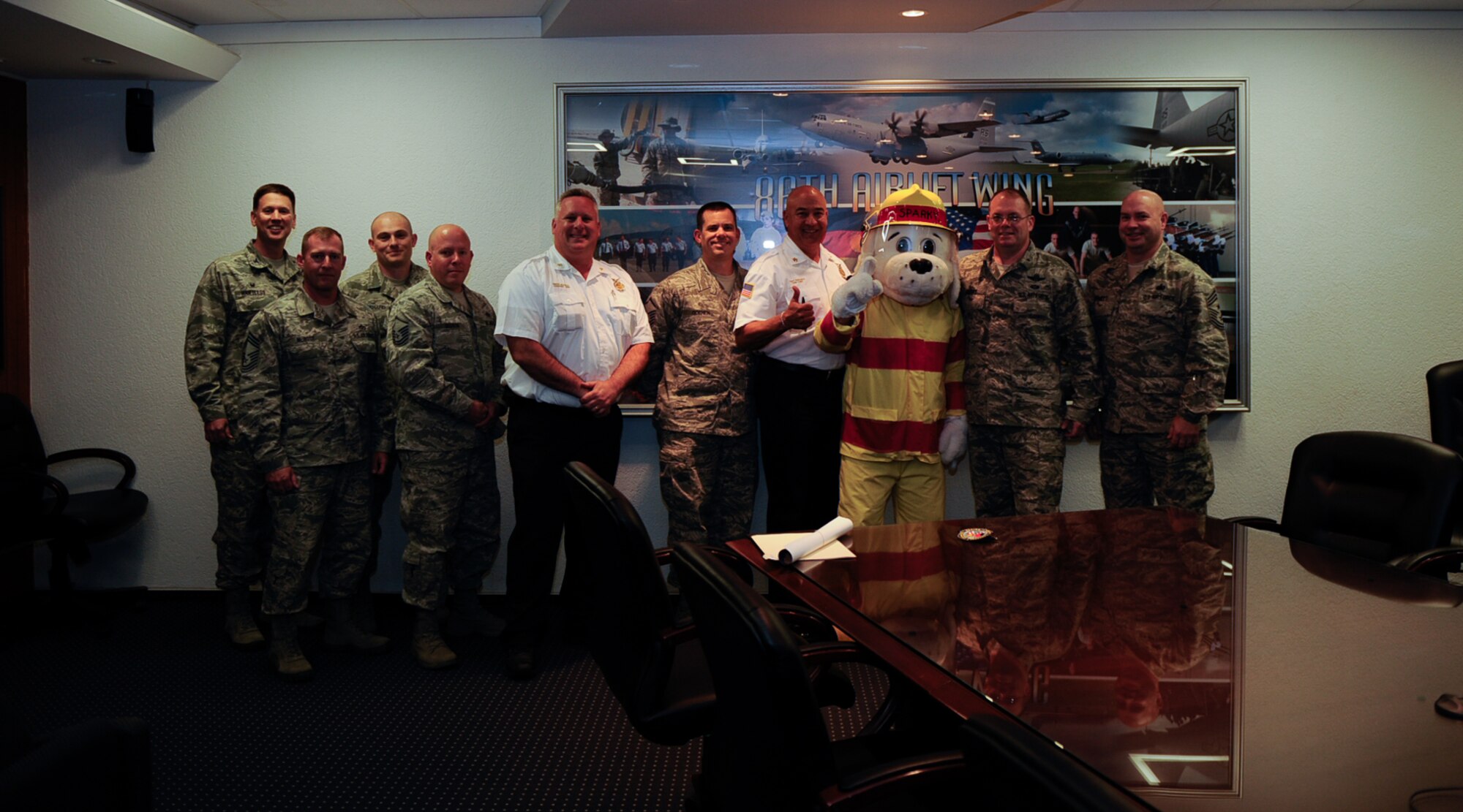 Brigadier Gen. Richard G. Moore, Jr. (second from right), 86th Airlift Wing commander, poses with members of the 86th Civil Engineer Squadron at Ramstein Air Base, Germany, Oct. 3, 2016. Fire Prevention Week is from Oct. 9 to 15. (U.S. Air Force photo by Airman 1st Class Savannah L. Waters)