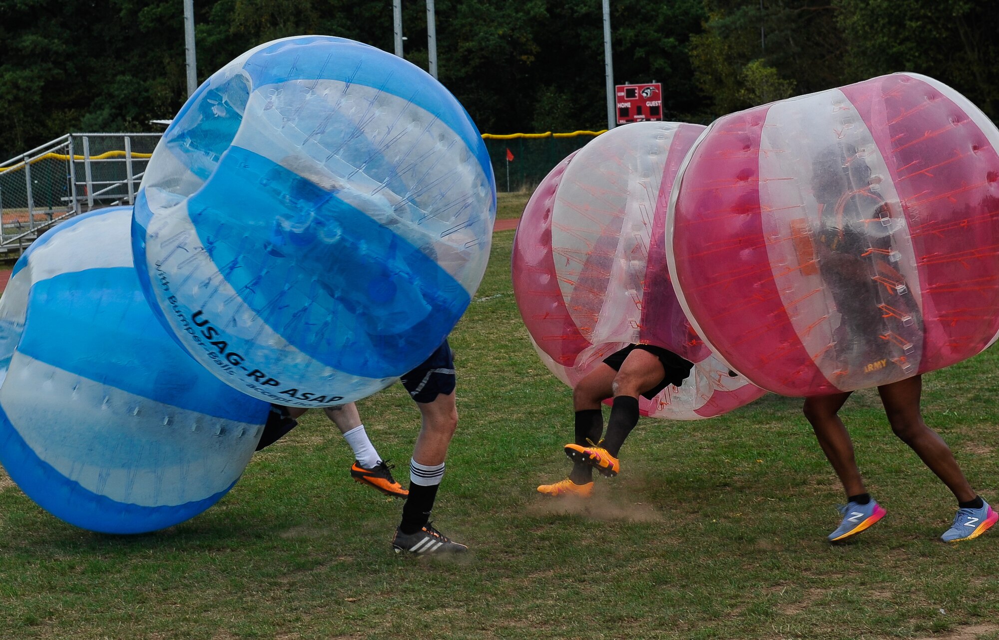 Airmen and Soldiers collide into each other during the Combined Federal Campaign-Overseas’ 2016 kick off bubble soccer match at Ramstein Air Base, Germany, Sept. 30, 2016. The CFC-O equips private sector and nonprofit sector organizations to achieve their philanthropic goals by providing revenue diversification strategies, employee engagement programs, CSR strategies and custom philanthropic funds. (U.S. Air force photo by Airman 1st Class Lane T. Plummer)