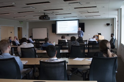 Dr. John Barkyoumb, director of strategic relations for Naval Surface Warfare Center, Carderock Division, speaks to engineers and scientists who may be interested in filing for a patent at some point in their Carderock careers during the patents and technology transfer training Sept. 20, 2016 in West Bethesda, Maryland.(U.S. Navy photo by Kelley Stirling/released)