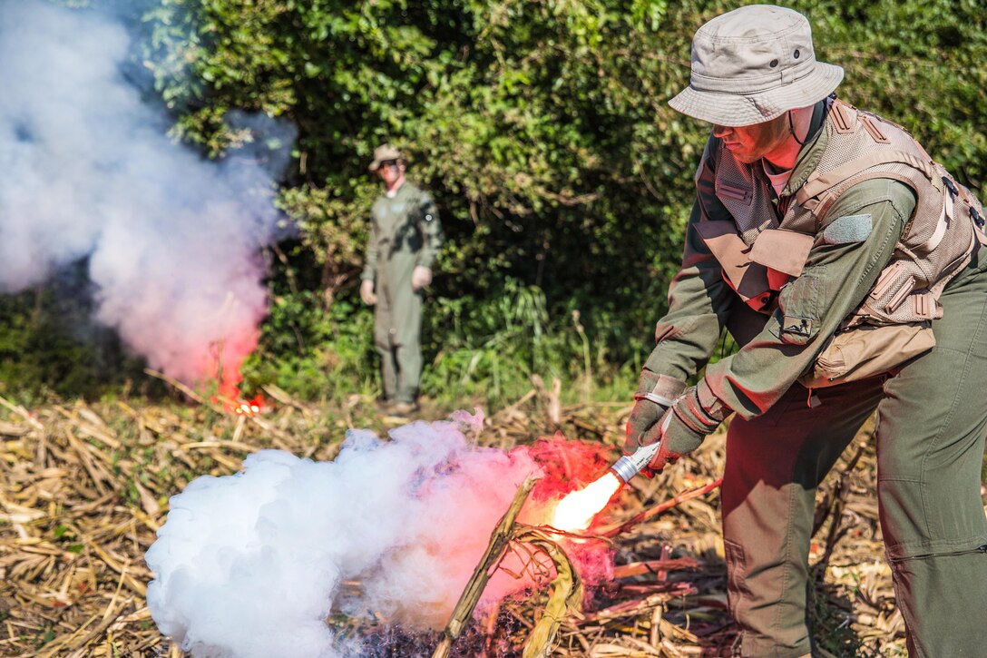 Air Force Senior Airman Cody Harter practices using a signal flare during survival, evasion, resistance and escape training at Rosecrans Air National Guard Base in St. Joseph, Mo., Sept. 29, 2016. Harter is assigned to the Missouri Air National Guard’s 180th Airlift Squadron. Air Force National Guard photo by Senior Airman Patrick P. Evenson
