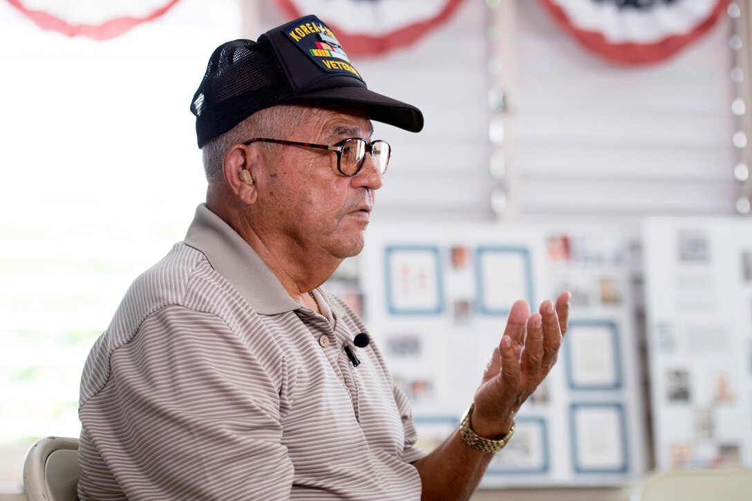 Retired Army Master Sgt. Santos Rodriguez, a veteran of the Korean and Vietnam wars, speaks about his military experience during an interview in Cabo Rojo, Puerto Rico, Aug. 10, 2016. DoD photo by EJ Hersom
