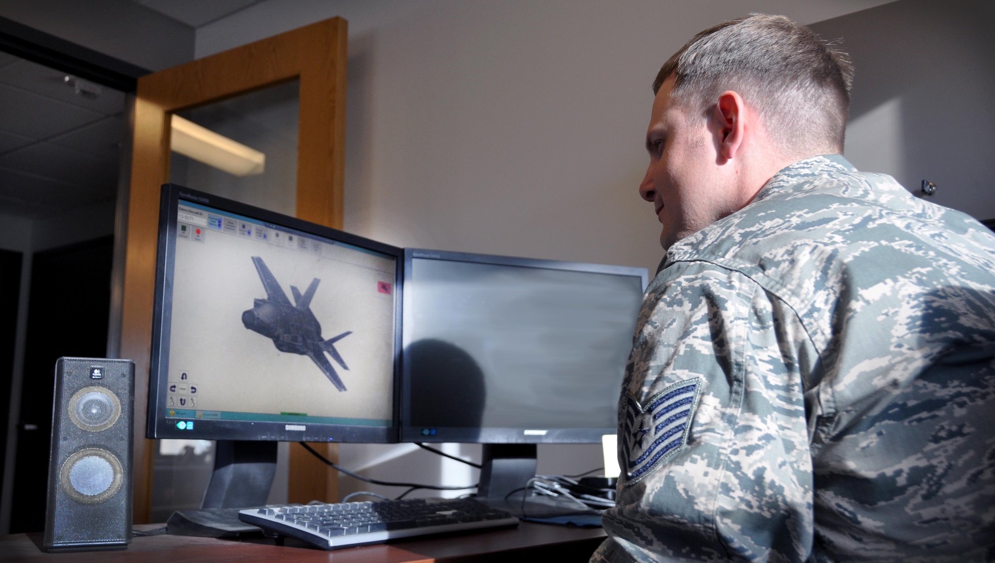 Tech. Sgt. Jake Lewis, 419th Maintenance Squadron, analyzes an F-35 assigned to Hill AFB in a 3D program that determines what measures need to be taken to keep the jet stealthy. Lewis is a low observable journeyman for the F-35 Lightning II. (U.S. Air Force photo/Bryan Magaña)