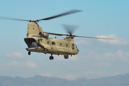 A CH-47 Chinook helicopter assigned to Joint Task Force-Bravo’s 1st Battalion, 228th aviation regiment, launches from Soto Cano Air Base, Honduras, Oct. 4, 2016, to stage at the Grand Cayman Islands to provide airlift capabilities for Hurricane Matthew relief efforts if requested by the U.S. Agency for International Development’s Office of Foreign Disaster Assistance. U.S. Southern Command directed a team of approximately 100 military personnel and nine helicopters to be staged and ready to support U.S. disaster relief operations in the Caribbean. (U.S. Air Force photo by Staff Sgt. Siuta B. Ika)