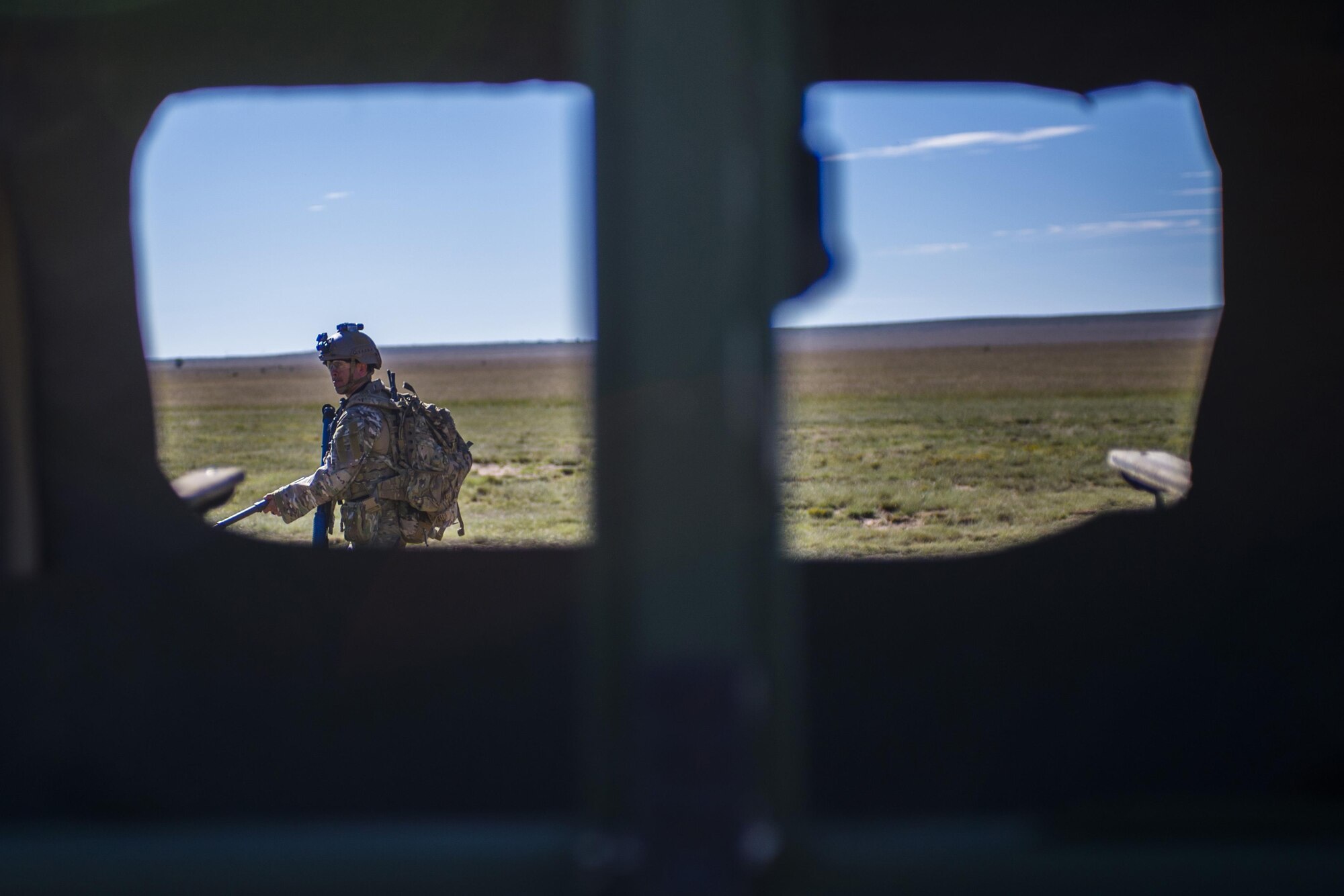 A member of the 27th Special Operations Civil Engineer Squadron Explosive Ordnance Disposal flight searches around a damaged vehicle during improvised explosive device training at Melrose Air Force Range, N.M., Sept. 28, 2016. The EOD members use a unique set of tools including a hand-held metal detector when searching the area for possible IED’s. (U.S. Air Force photo by Senior Airman Luke Kitterman/Released)