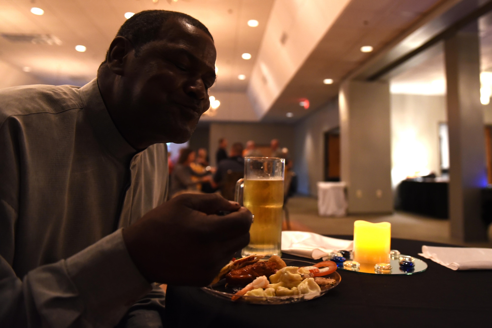 Eric Applewhite, Razorback Inn laborer, samples an entrée during a food tasting event hosted by the 19th Force Support Squadron Oct. 3, 2016, at Hangar 1080 on Little Rock Air Force Base, Ark. The event provided an opportunity for attendees to sample new food items available at base dining facilities under the 19th FSS non-appropriated funds operation. (U.S. Air Force photo by Airman Kevin Sommer Giron)
