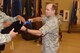 Col. Craig Ramsey, 576th Flight Test Squadron commander, secures the old 576th FLTS flag before the unveiling of a new one during a realignment ceremony, Sept. 30, 2016, Vandenberg Air Force Base, Calif. The Air Force Global Strike Command Operations Directorate transferred administrative control of the 576th FLTS to the 20th Air Force commander, effective Oct. 1. (U.S. Air Force photo by Airman 1st Class Robert J. Volio/Released)