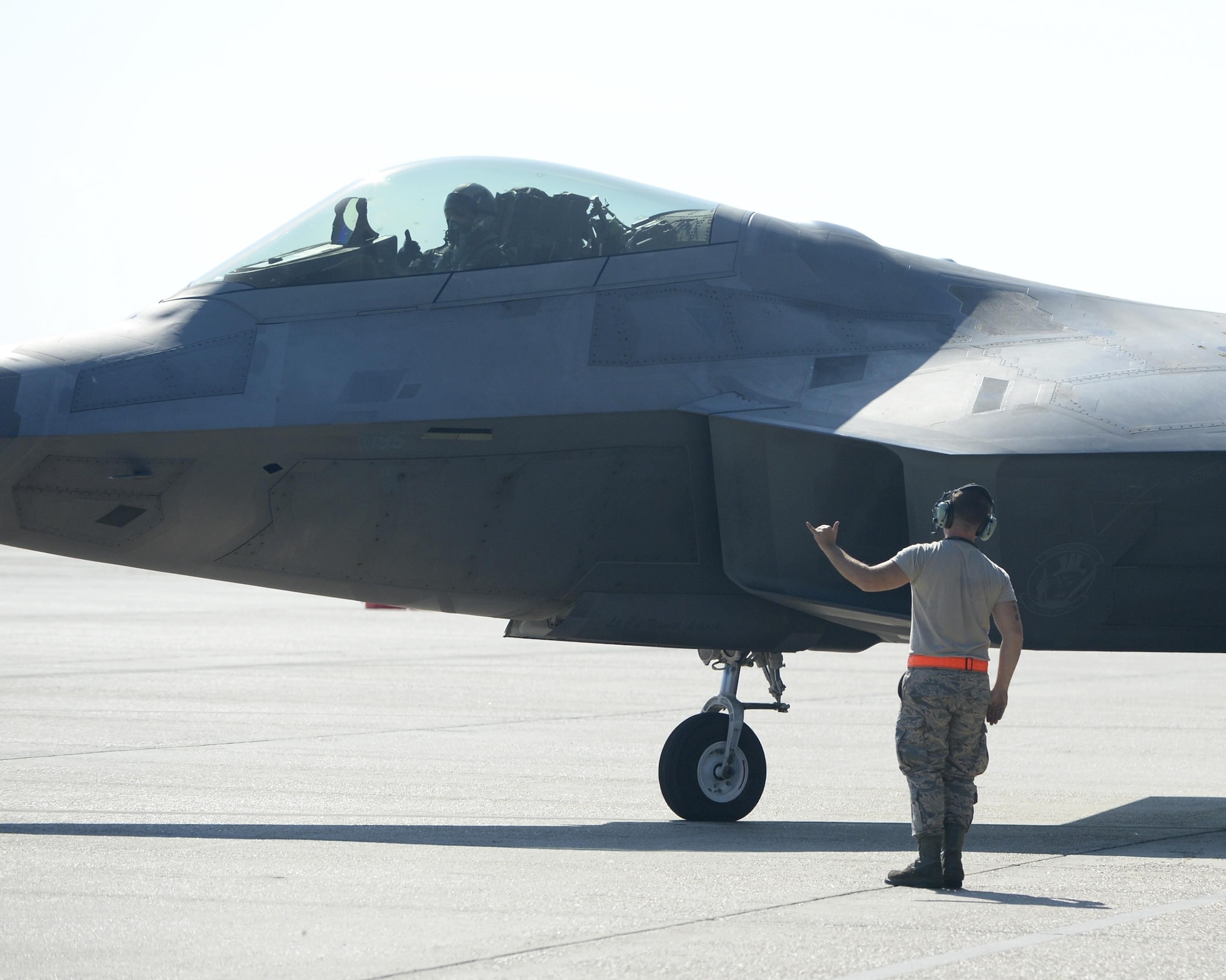 U.S. Air Force Senior Airman Jared Carnahan, 44th Fighter Group crew chief, signals to a taxiing pilot on the flight line at Tyndall Air Force Base, Fla., Sept. 10, 2016. The 44th FG is a geographically-separated unit from the Air Force Reserve Command's 301st Fighter Wing at Naval Air Station Joint Reserve Base Fort Worth, Texas. The 44th Fighter Group supports the 95th Fighter Squadron at Tyndall by providing unrivalled combat air power. (U.S. Air Force photo by Airman 1st Class Cody R. Miller/Released)