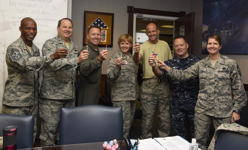 Joint Base Andrews leadership finish off the Flu Shot Kick-Off with lollypops on Joint Base Andrews, Md., Oct. 3, 2016.  Military members are required to receive an annual flu shot and a base-wide vaccination drive for retirees, active duty and dependents is slated for Oct. 17-18 from 8 a.m. to 4 p.m. at the post theater. (U.S. Air Force photo by Airman 1st Class Valentina Lopez)