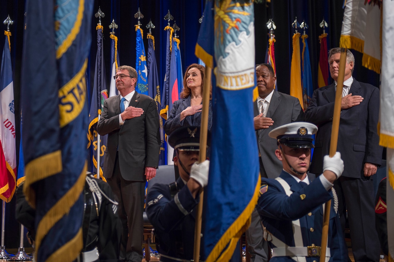 Defense Secretary Ash Carter shows respect during the opening presentation for the Department of Defense Disability Awards ceremony at the Pentagon, Oct. 4, 2016. DoD photo by Air Force Tech. Sgt. Brigitte N. Brantley