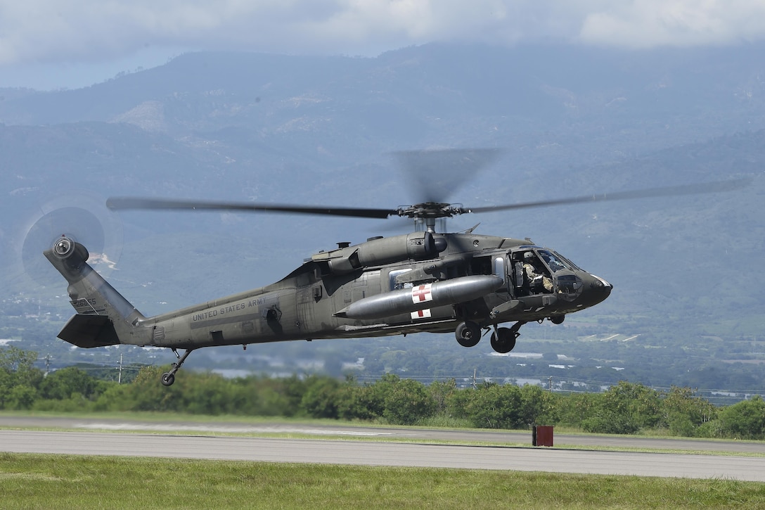 An HH-60L Black Hawk helicopter prepares to launch from Soto Cano Air Base, Honduras, Oct. 4, 2016, to stage at the Grand Cayman Islands to support Hurricane Matthew relief efforts if requested by the U.S. Agency for International Development’s Office of Foreign Disaster Assistance. The Black Hawk is assigned to Joint Task Force-Bravo’s 1st Battalion, 228th Aviation Regiment. Air Force photo by Staff Sgt. Siuta B. Ika