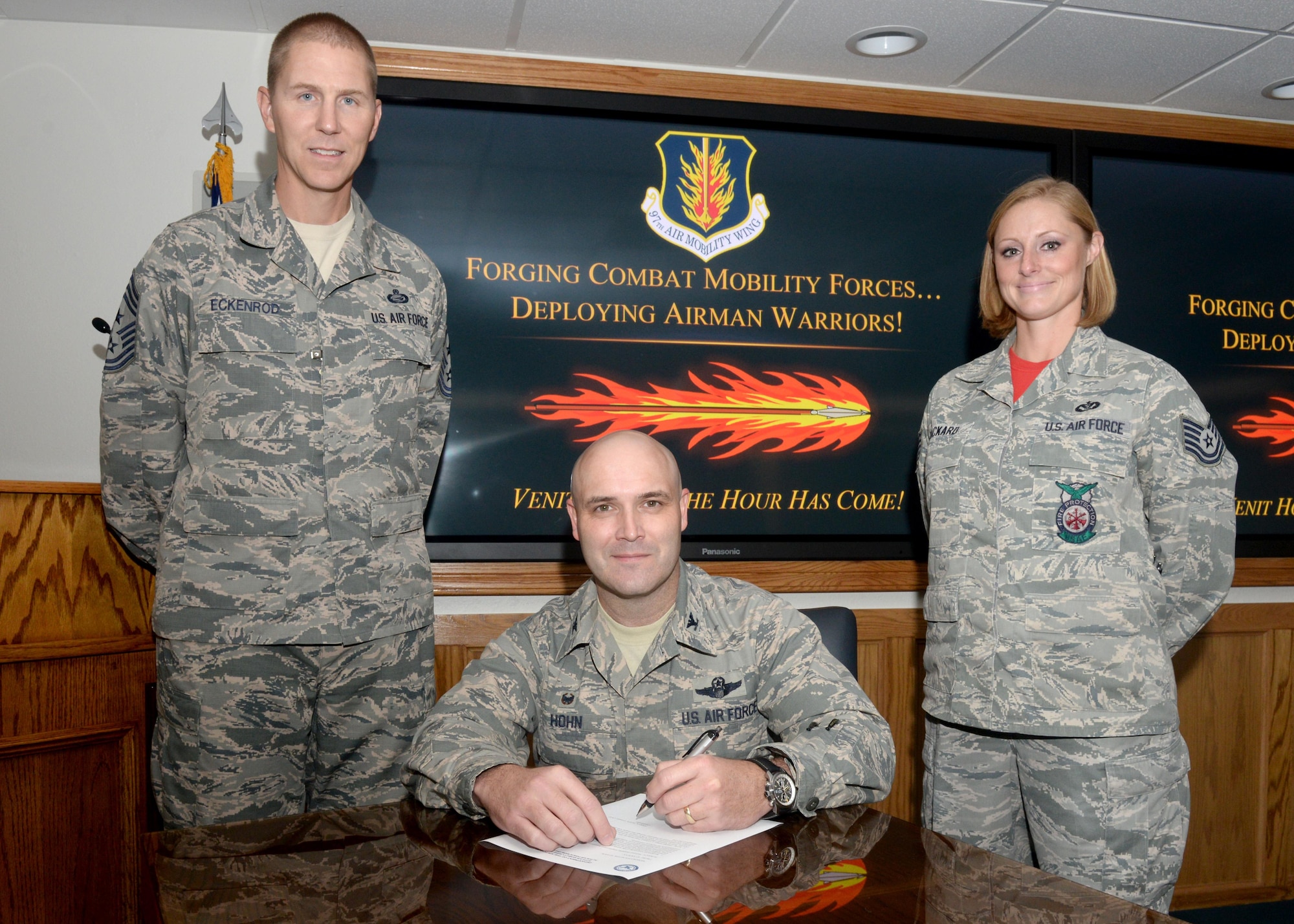 U.S. Air Force Col. Todd Hohn, 97th Air Mobility Wing commander, Chief Master Sgt. Philip Eckenrod, 97th AMW command chief, and Tech. Sgt. Jessica Packard, Altus AFB Fire Department deputy fire chief, attend the signing of the proclamation for National Disability Employment Awareness Month, Sept. 30, 2016, at Altus Air Force Base, Okla. The proclamation signifies the bases participation during NDEAM. (U.S. Air Force Photo by Airman Jackson N. Haddon/Released).