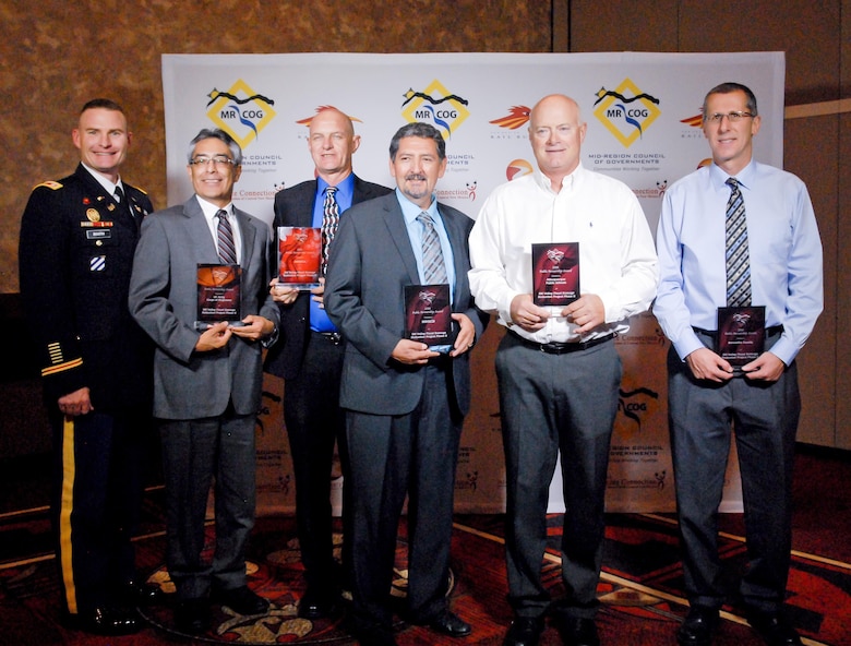 (l-r): Lt. Col. James Booth, Albuquerque District Commander and project managers Jerry Nieto, USACE; Brad Bingham, AMAFCA; Ray Gomez, MRGCD; Robert Kane, APS; and Brad Catanach, Bernalill County, accept the award, Sept. 9, 2016.