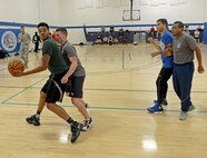 McChord Field Airmen play 3-on-3 basketball during the Annual 2016 McChord Field Sports Day event Sept. 30, 2016 at Joint Base Lewis McChord, Wash. Sports day provided a series of events and activities to promote fitness and esprit-de-corps for McChord Airmen. (U.S. Air Force photo/Senior Airman Divine Cox)