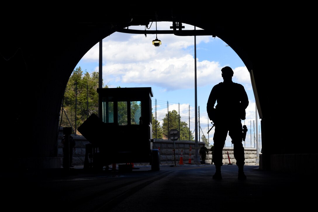 CHEYENNE MOUNTAIN AIR FORCE STATION, Colo. – Airman 1st Class Raymond Lopez Llaurador, 721st Security Forces Squadron defender, stands guard at the North Portal of Cheyenne Mountain Air Force Station, Colo., Sept. 15, 2016. Lopez earned a both a bachelor’s and master’s degree in physical education, and spent 15 years teaching in Puerto Rico before joining the military. (U.S. Air Force photo by Airman 1st Class Dennis Hoffman)