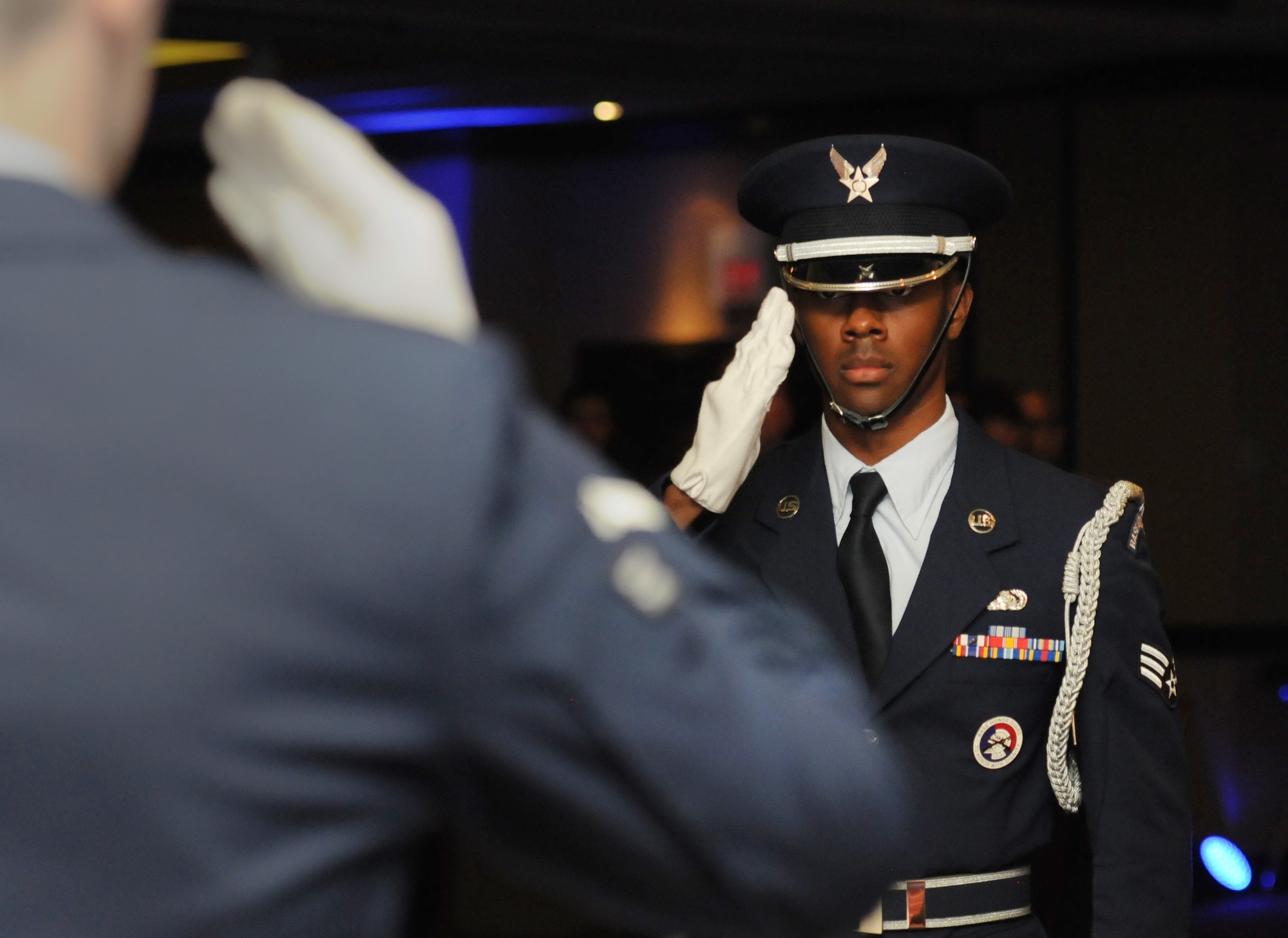 Senior Airman Sean Goddard, Keesler Honor Guard member, renders a salute while performing a POW/MIA table ceremony during the Keesler Air Force Ball at the Imperial Palace Casino Sept. 24, 2016, Biloxi, Miss. The event was sponsored by the Air Force Association John C. Stennis Chapter #332 to celebrate the Air Force’s 69th birthday and the base’s 75th anniversary. (U.S. Air Force photo by Kemberly Groue/Released)