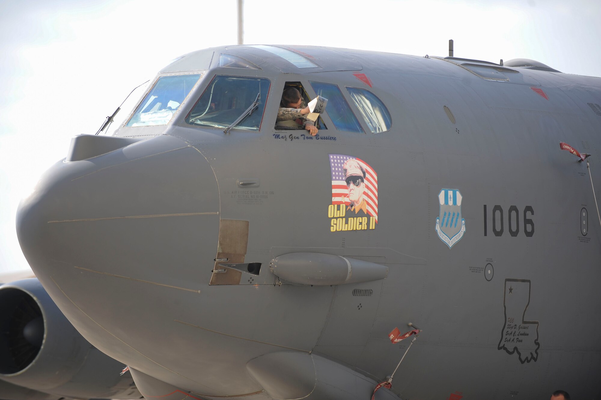 An Eighth Air Force Airman unveils the new commander's name on a B-52 at Barksdale Air Force Base, La., during a change of command ceremony Oct. 4, 2016. U.S. Air Force Maj. Gen. Thomas Bussiere assumed command as the 53rd commander of The Mighty Eighth. (U.S. Air Force photo by Airman 1st Class Stuart Bright)