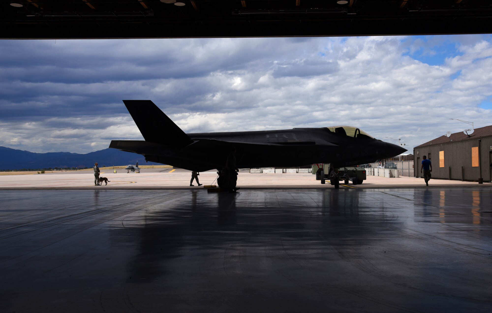 PETERSON AIR FORCE BASE, Colo. – An Air Force F-35A Lightning II assigned to the 58th Fighter Squadron at Eglin Air Force Base, Fla., is transported into a hangar at Peterson AFB, Colo., Sept. 30, 2016. The F-35’s stealth capabilities are unprecedented in tactical fighter aviation. An integrated airframe design, advanced materials and other features make the F-35 virtually undetectable to enemy radar. (U.S. Air Force photo by Airman 1st Class Dennis Hoffman)
