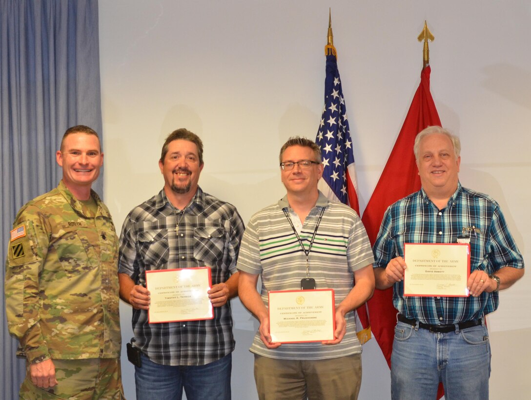 ALBUQUERQUE, N.M. – District Commander Lt. Col. James Booth recognized (l-r) Tim Tetrick, Mike Prudhomme, and David Abbott, Sept. 26, 2016, for their work in completing a cost estimate for the National Nuclear Security Administration Albuquerque Complex project located here.